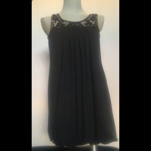 Black Sleeveless Flounce Dress by Violet